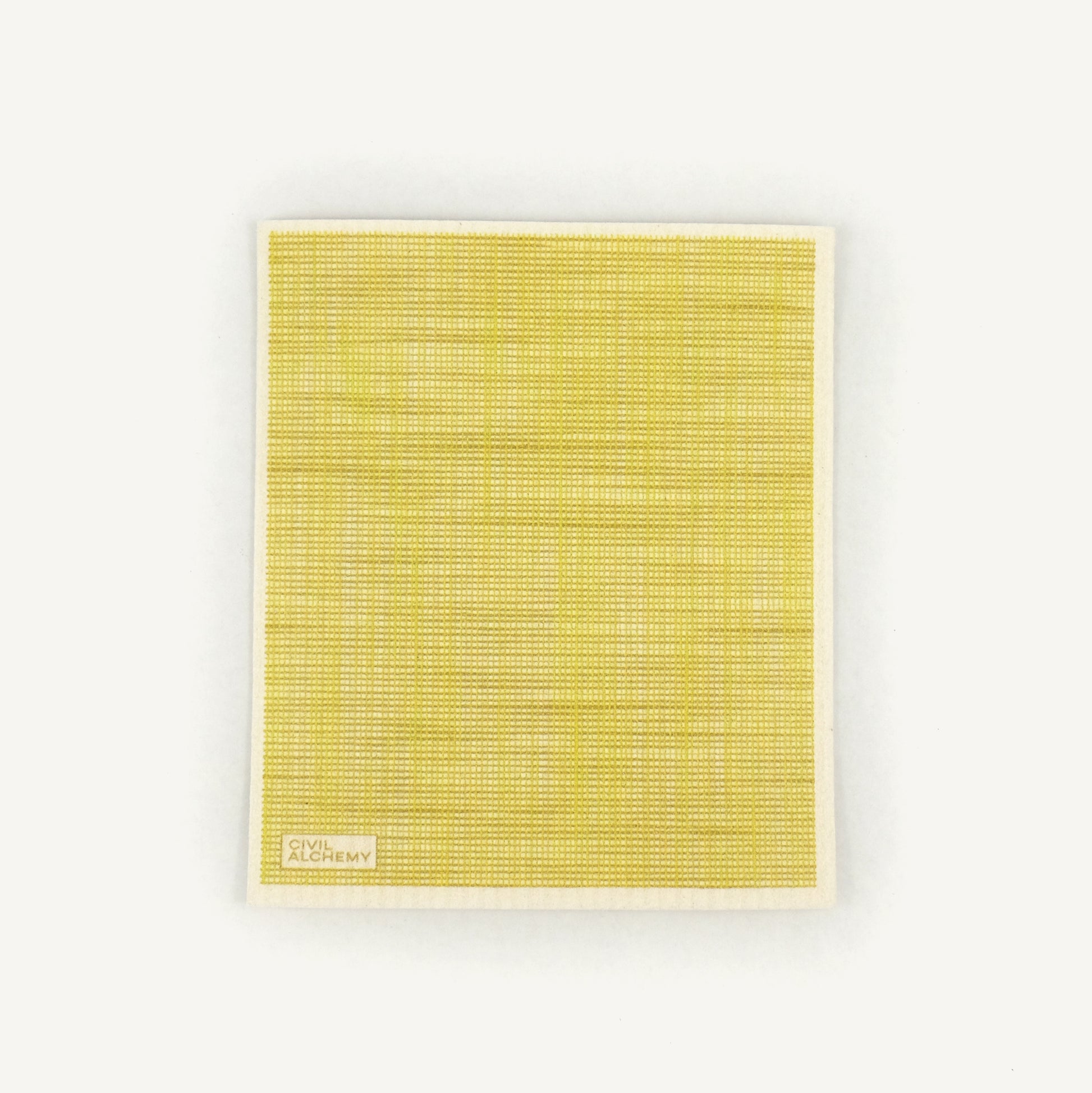 Yellow textured Swedish dishcloth with 'Civil Alchemy' logo on a white background