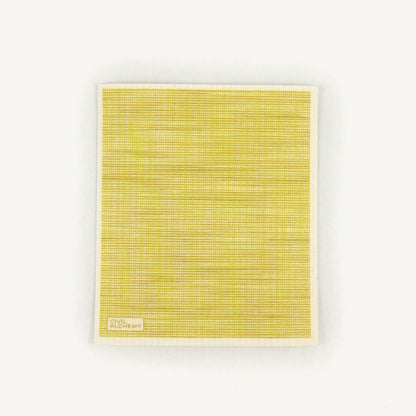 Yellow textured Swedish dishcloth with 'Civil Alchemy' logo on a white background