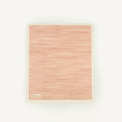 Pink woven Swedish dishcloth on a white background