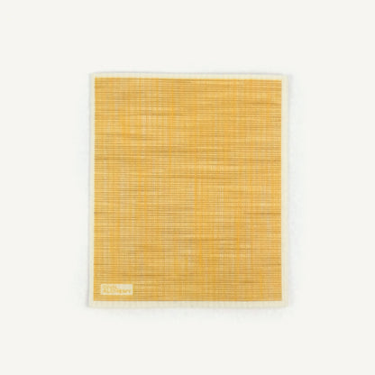 Yellow woven Swedish dishcloth on a white background