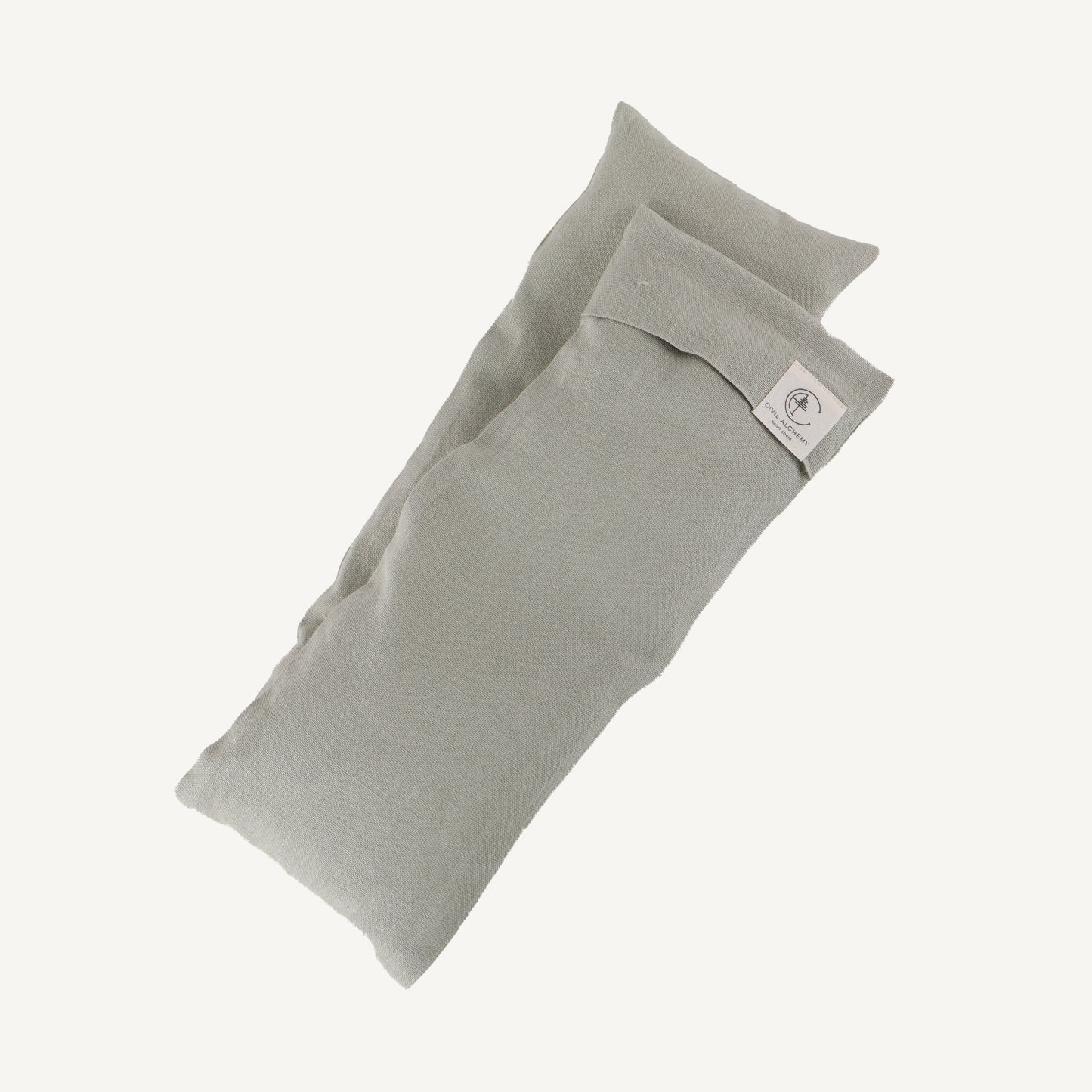 Sage fabric pillow on a white background