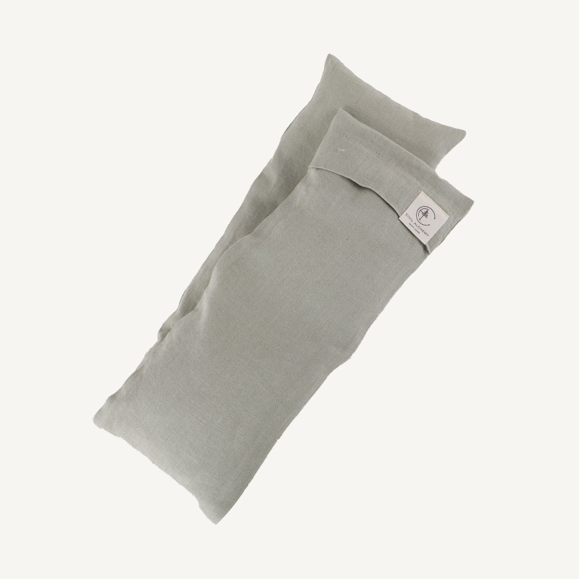 Sage fabric pillow on a white background