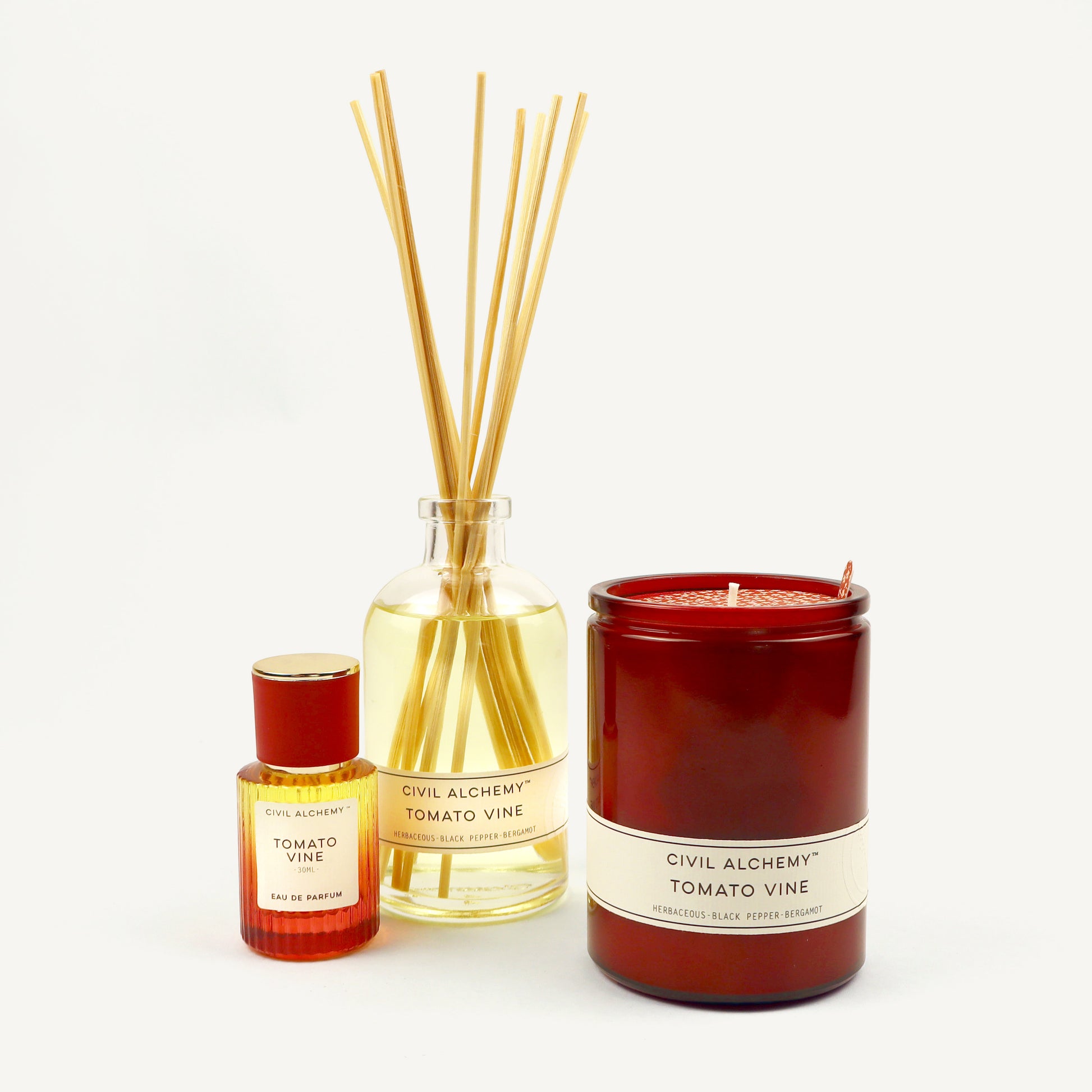 Candle and diffuser set with 'Civil Alchemy Tomato Vine' branding on a white background