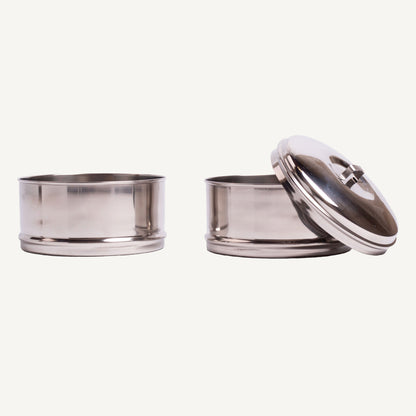 Two stainless steel containers with lids on a white background
