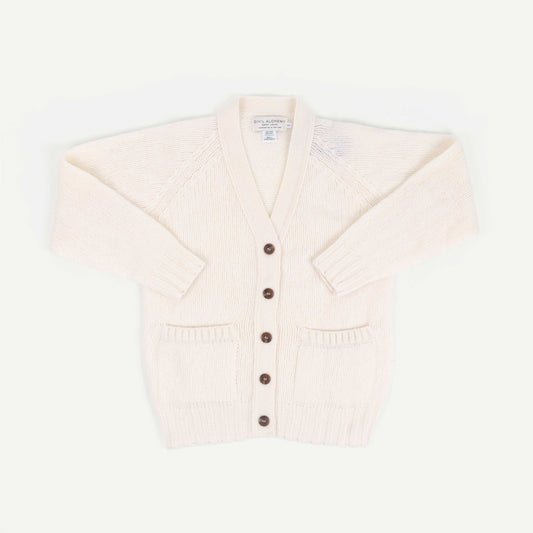 Cream-colored cardigan with brown buttons on a white background