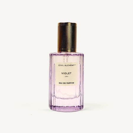 Purple perfume bottle with gold cap on a white background