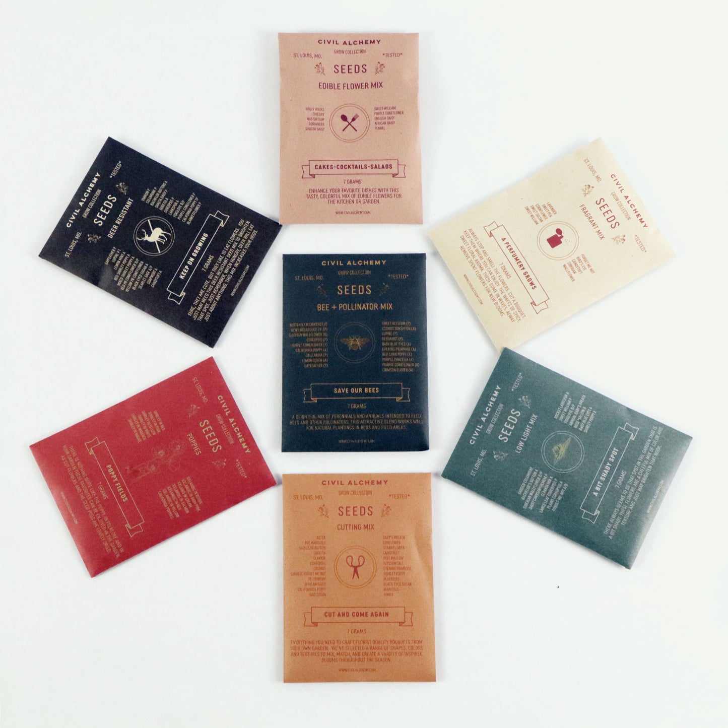 Collection of seed packets with various designs on a white background