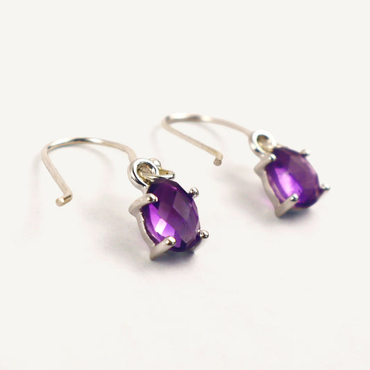 Pair of amethyst earrings on a white background