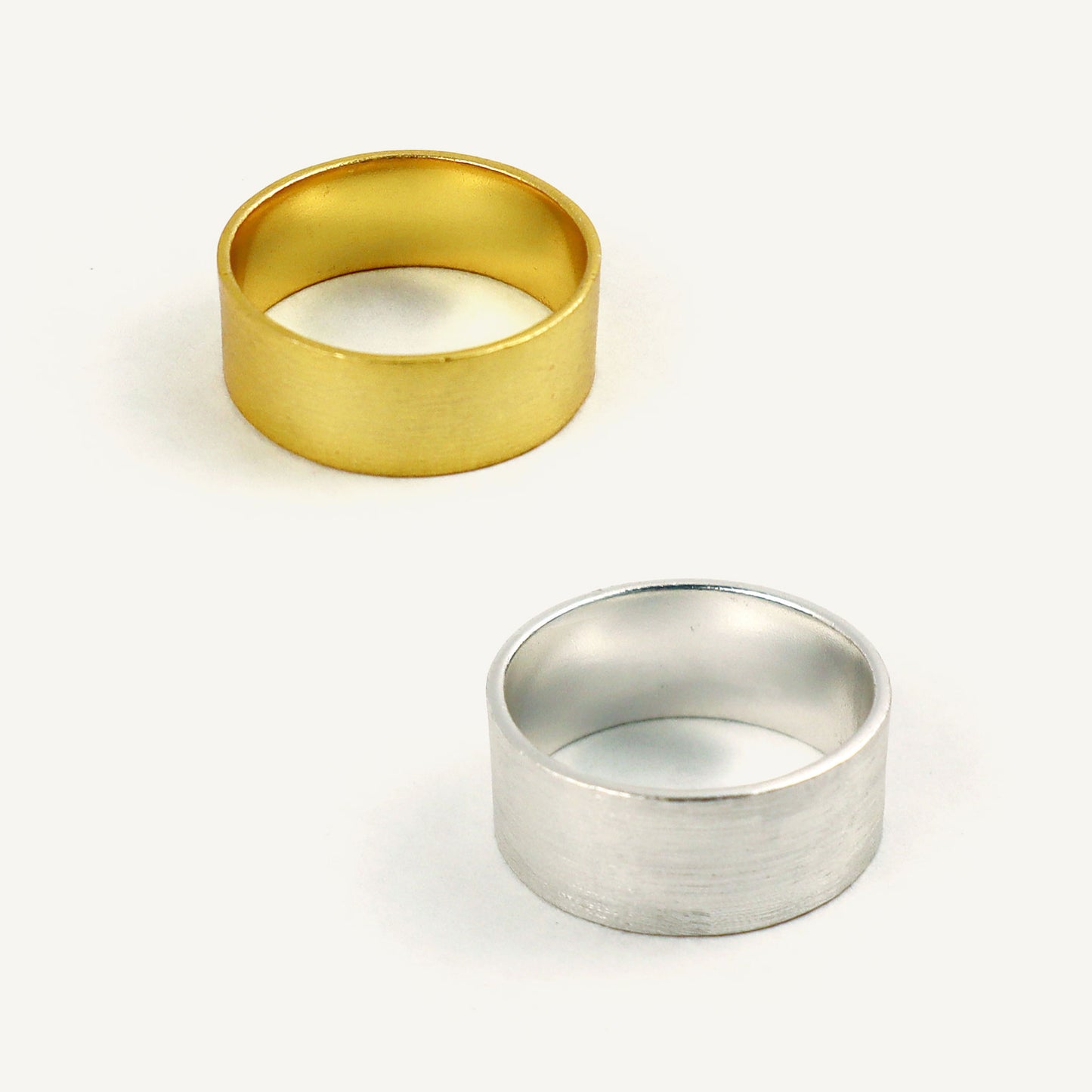 Gold and silver rings on a white background