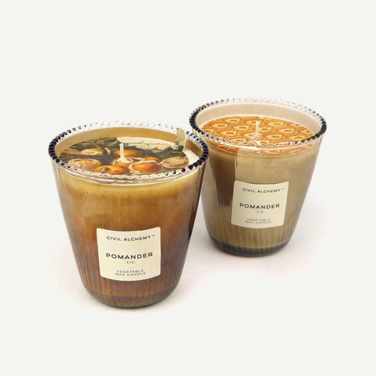 Two pomander candles from Civil Alchemy on a white background