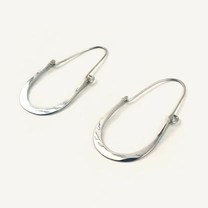 Pair of silver hoop earrings on a white background