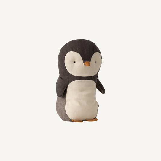 Stuffed penguin toy on a white background