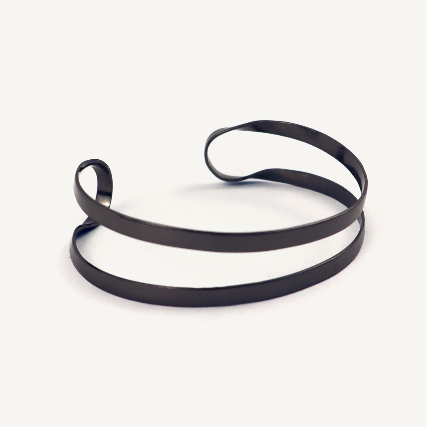 Black rubber band on a white background