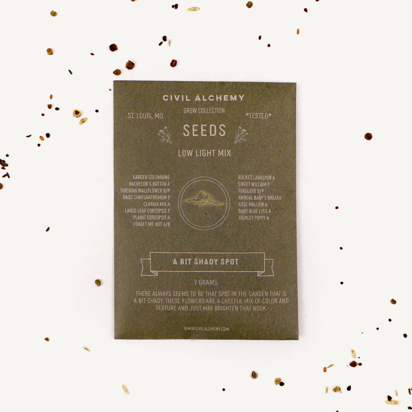 Seed packet from Civil Alchemy on a white background with small seeds scattered around