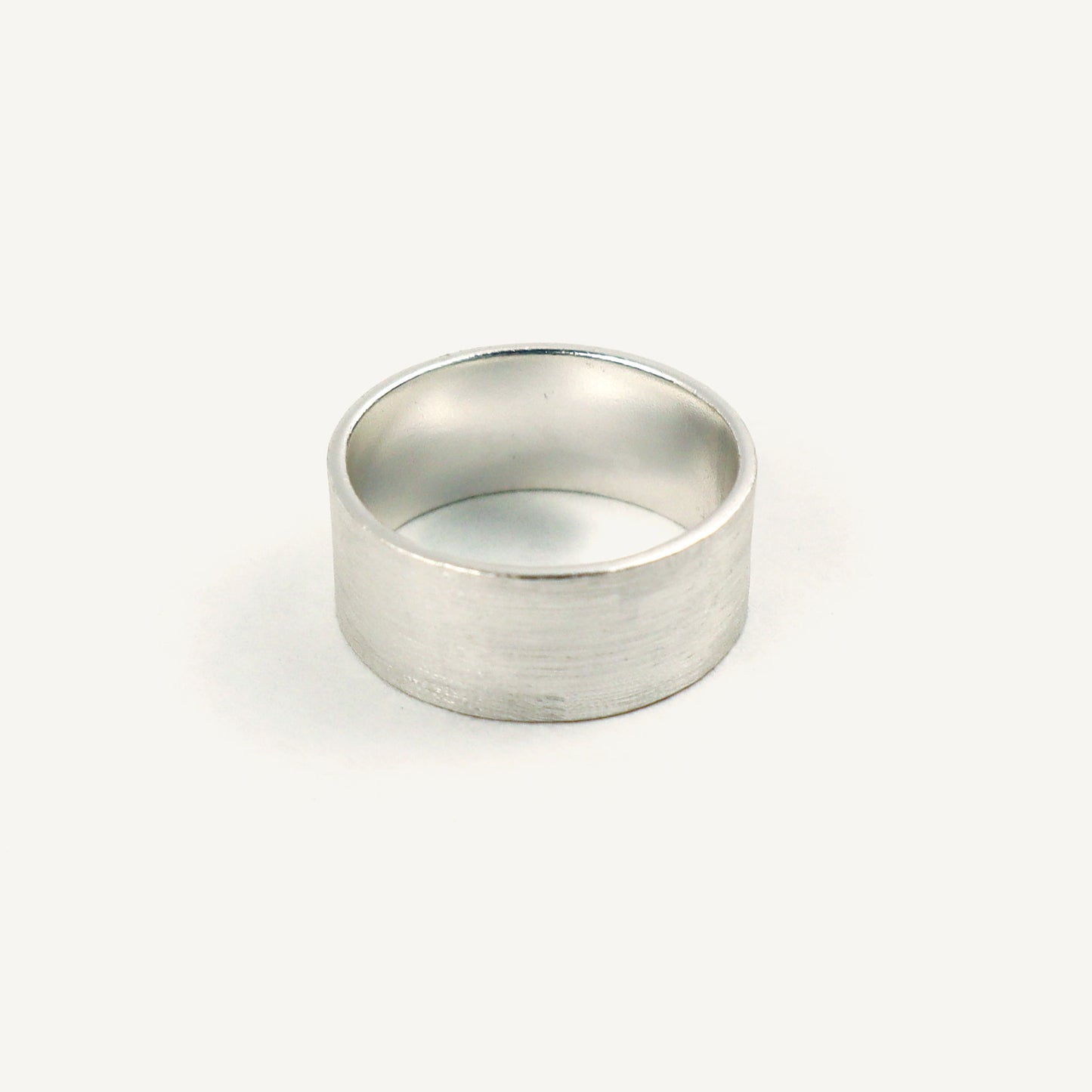 Silver ring on a white background