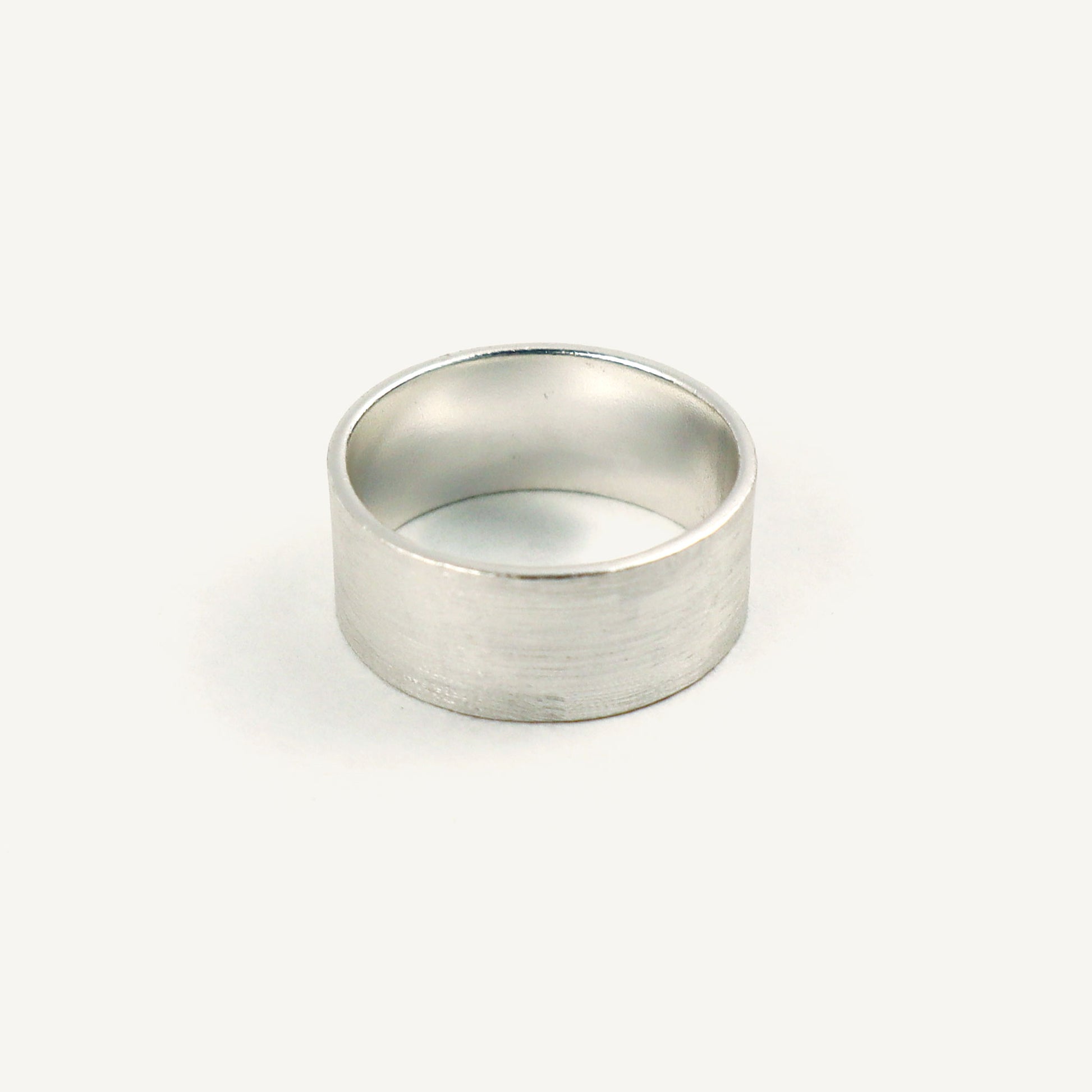 Silver ring on a white background