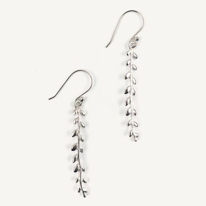 Silver leaf-shaped earrings on a white background
