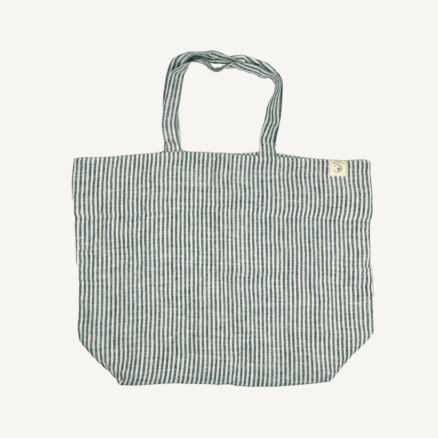 A striped linen tote bag with handles, displayed against a white background.