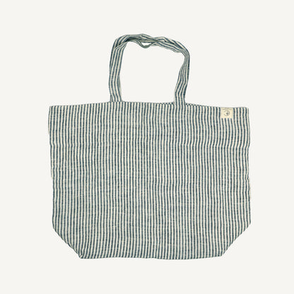 A striped linen tote bag with handles, displayed against a white background.