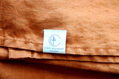 Orange fabric with a 'Civil Alchemy' label in the center