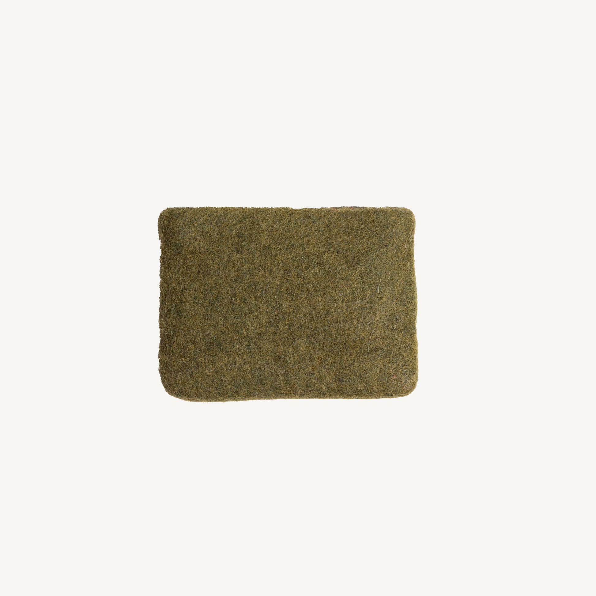A solid olive wool coin pouch with a brass zipper, hand-felted by artisans in Nepal.
